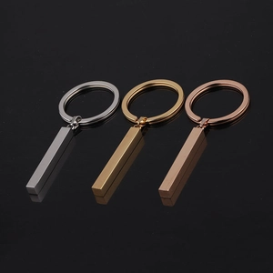 Three minimalist rectangular steel pendants in silver, gold, and rose gold on black mirror