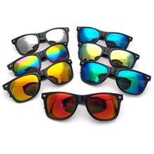 Detail of assorted kaleidoscope sunglasses with multi-colored reflective lenses and black frames