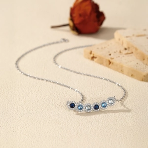 S925 sterling silver necklace with gradient blue and white circular diamond pendant