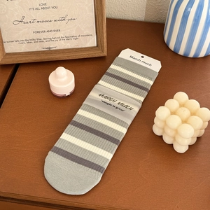 Chic grey striped crew socks for women featuring minimalist cotton knit design and packaging