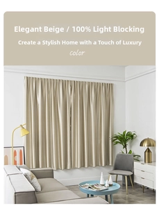 Detail of elegant beige blackout curtain showing 100% light blocking fabric texture