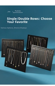Detail view of necklace display boards featuring single and double rows of gold hooks