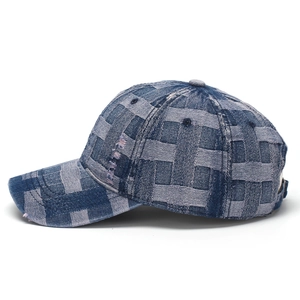 Detailed view of denim baseball cap showing distressed woven checkerboard texture