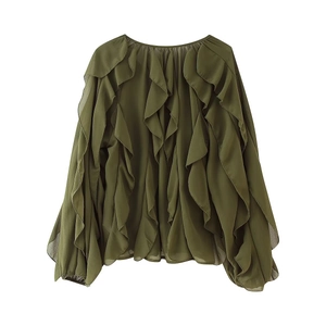 Detail of layered ruffles on an olive green chiffon long sleeve blouse with elegant texture