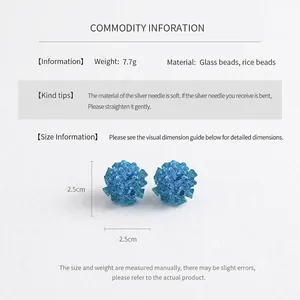 Detailed view of blue beaded flower earrings showing dimensions of 2.5cm by 2.5cm