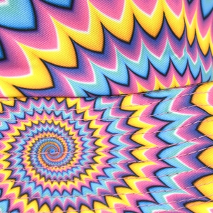 Macro shot of durable fabric stitching and psychedelic colorful print on the bucket hat