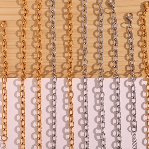 Detail of 18K gold and silver stainless steel cross chains with lobster clasps