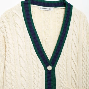 Women's cable-knit v-neck cardigan with contrast stripes and button-front closure