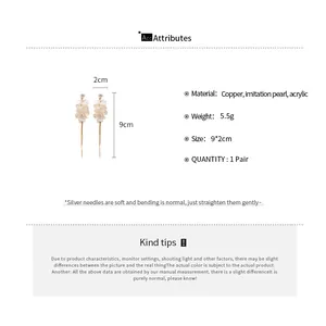 Detailed size chart for white petal tassel earrings showing 9x2cm dimensions and copper material