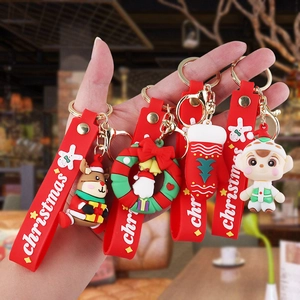 Detail of PVC Christmas keychains featuring reindeer, wreath and gloves ornaments
