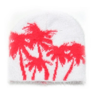 Detailed macro view of plush faux mink fur beanie with bright pink palm tree jacquard