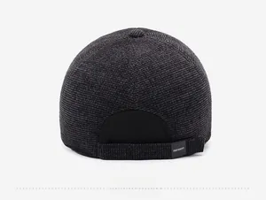 Rear view of dark gray corduroy baseball cap showing adjustable strap and texture