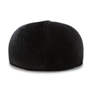 Detail of black faux mink newsboy cap showing thick warm fur lining and ear protection