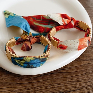 Matte gold open cuff bracelets wrapped in silk scarf fabric for elegant women jewelry