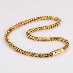 Detailed close-up of golden stainless steel Franco chain with secure lobster clasp