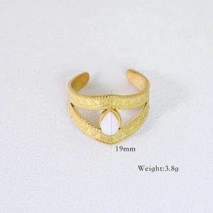 Detail of 14k gold plated vintage ring with white oval stone and 19mm open design