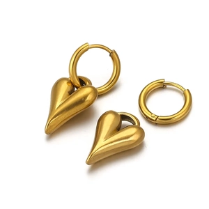 Golden stainless steel heart pendant earrings set with detachable hoop on white background