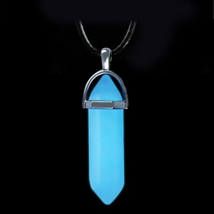 Luminous blue hexagonal column crystal pendant with black cord on dark background