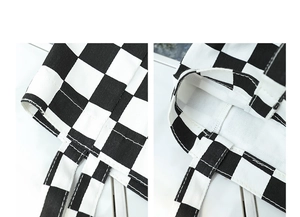 Detail of chessboard canvas tote bag showing reinforced stitching and fabric texture