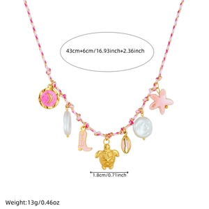 Detail of pink cord necklace with charms like starfish, turtle, shell and boot