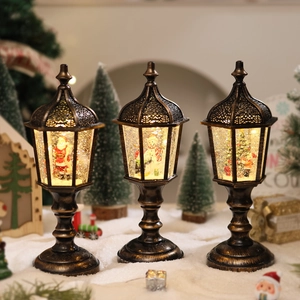 Three vintage gold Christmas lanterns featuring Santa and snowman with glowing snow effect