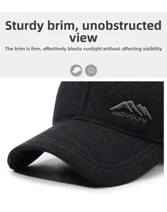 Detail of grey wool baseball cap showing rigid brim design and embroidered mountain logo