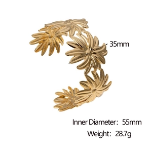 Detail view of golden daisy cuff bracelet showing 55mm inner diameter and 35mm flower width