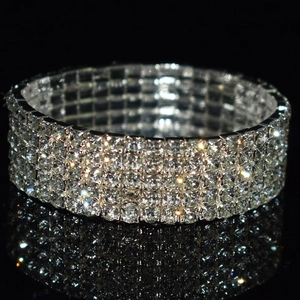 Macro view of four-row rhinestone elastic bridal bracelet with shimmering silver finish