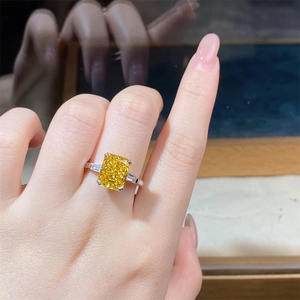 Macro shot of S925 silver ring featuring radiant cut yellow zircon and side stones