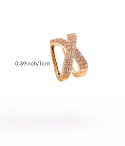 Detail of rose gold X-shaped ear cuff with fine zircons and 1cm size measurements