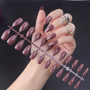 Glossy almond press-on nails in dusty rose pink finish with a droplet shape design
