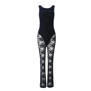 Close-up of intricate hollow lace patterns on black flare trousers jumpsuit
