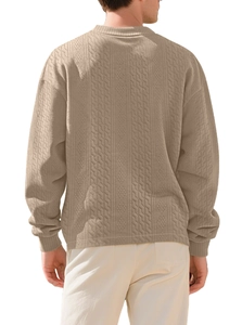 Rear view of khaki cable knit sweater showing textured vertical jacquard patterns