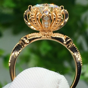 Luxurious rose gold crown ring featuring a large round brilliant cut cubic zirconia stone