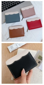 Close-up of litchi grain PU leather coin purses with wavy edges and metal zippers