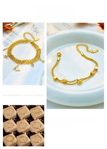 Detailed macro view of gold-plated bracelets featuring butterfly and geometric charms