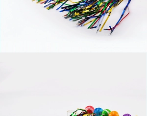 Detailed view of colorful metallic party tinsel ribbons and compact elastic pom balls