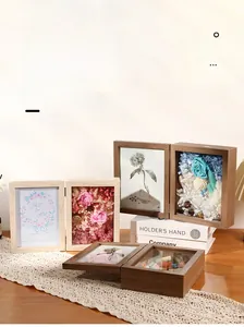 3D wooden shadow box frame with preserved flowers and photo display in warm lifestyle setting