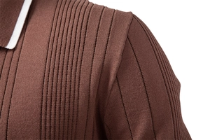 Detailed macro shot of brown knitted polo sweater shoulder seam and vertical ribbed texture