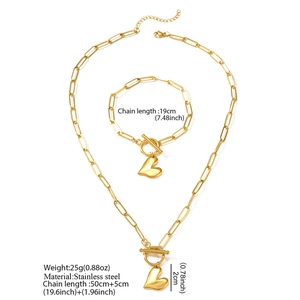 Golden stainless steel heart pendant jewelry set with paperclip chain and toggle clasp