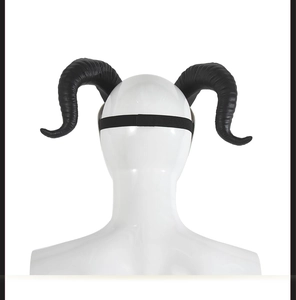 Rear view of black devil goat horns with elastic headband on a white mannequin head