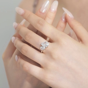 Close-up of S925 silver ring featuring two pear-shaped ice-cut cubic zirconia stones