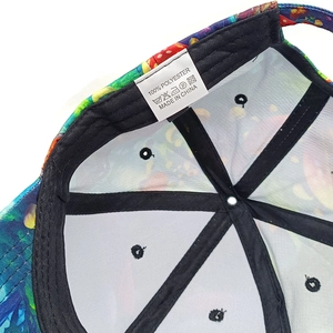 Detailed macro view of internal 100% polyester material and labels of a baseball cap