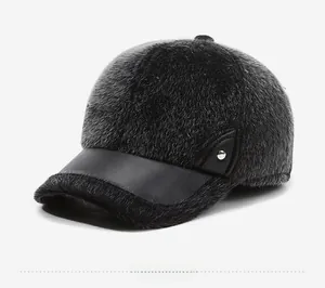 Detail of plush faux mink winter baseball cap with matte leather brim and metal side buckles