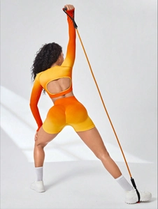 Detail view of seamless ribbed ombre yoga set with open back long sleeve top and shorts