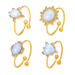Set of four 18K gold plated opal rings with sparkling rhinestones in various shapes