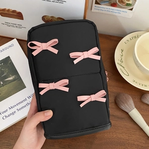 Cute black cosmetic bag with pink bows and large capacity for skincare storage