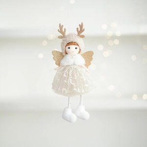 Detail of plush Christmas angel doll with lace skirt and glittery antlers on gold background