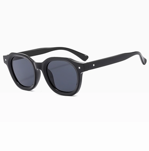 Detail of black polygon sunglasses frame with silver square studs on the side hinges