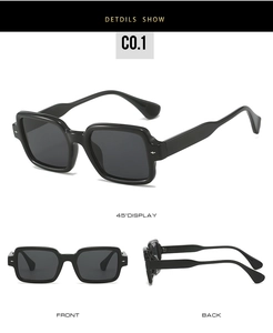 Detail view of square black sunglasses with silver rivet accents and thick frames